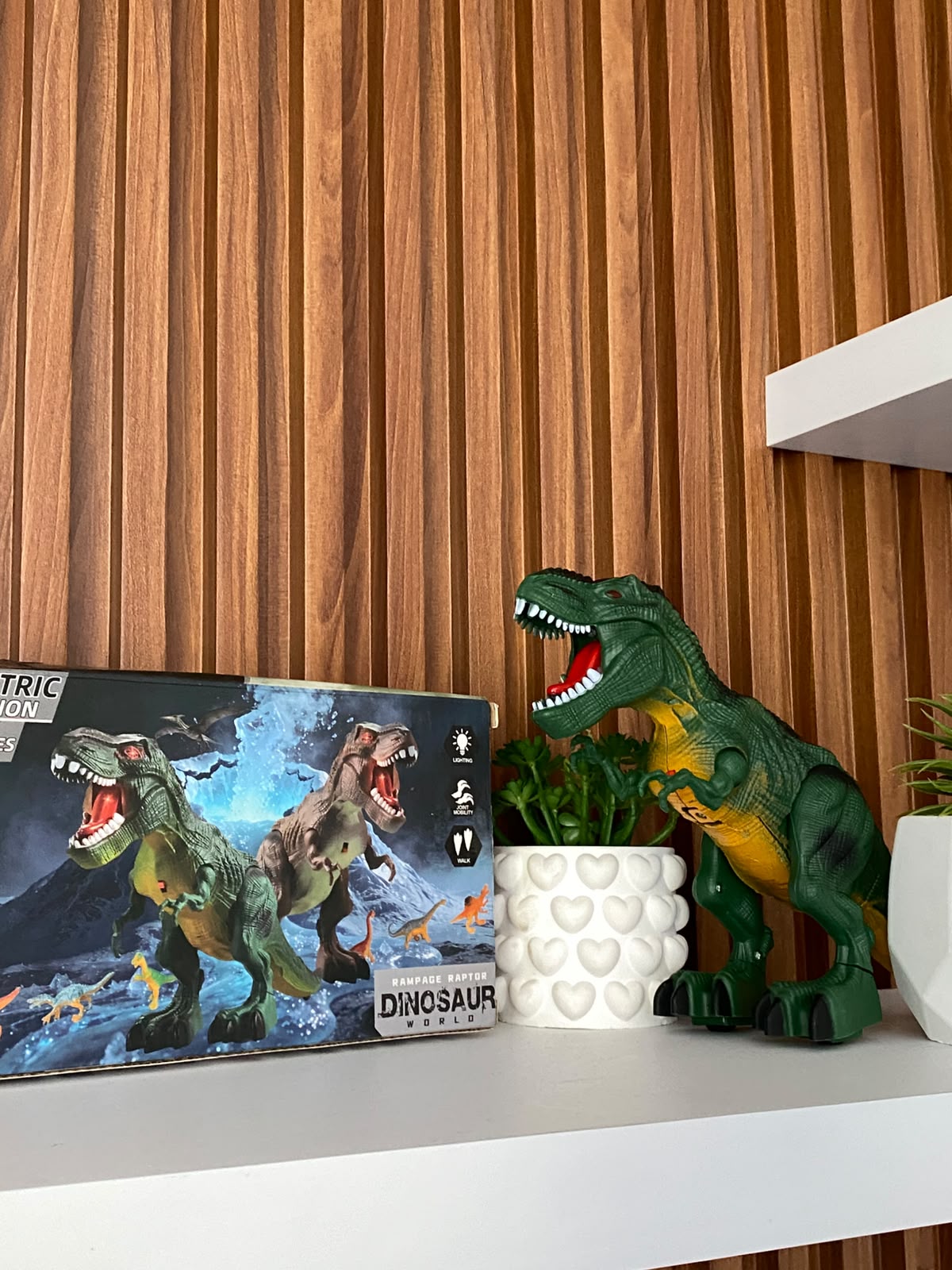 Dinosaurio de juguete interactivo con movimiento,luces y sonido